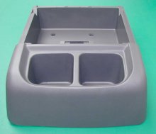 Automotive center console made from recycled plastic chips (originally from bumpers)